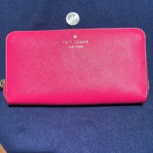 kate spade bright pink zip-around saffiano wallet with gold logo
